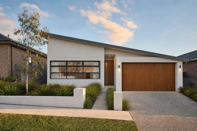31 Quandong Place: a white rendered home with a skillion roof and a timber-battened garage door