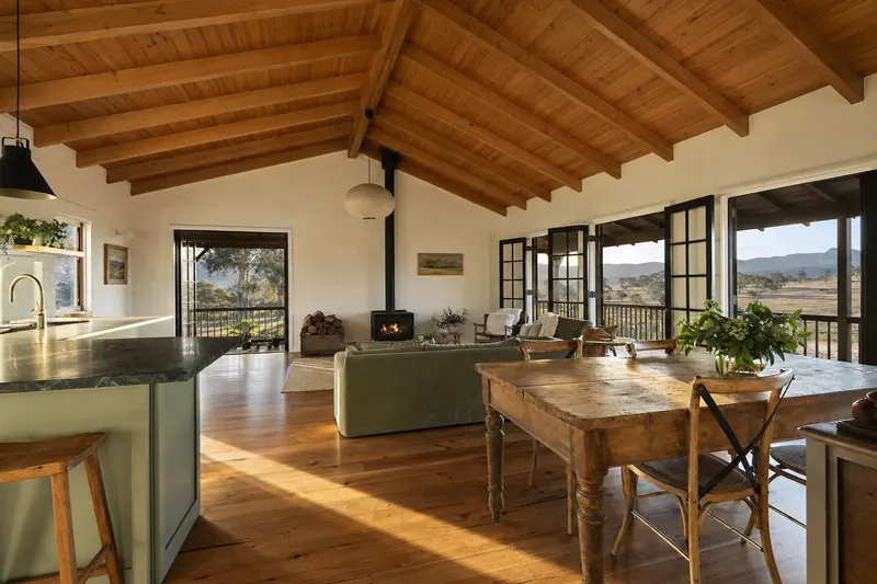 5 Ridgeline Terrace inside: family room with a raked timber ceiling and French doors to the verandah and paddocks