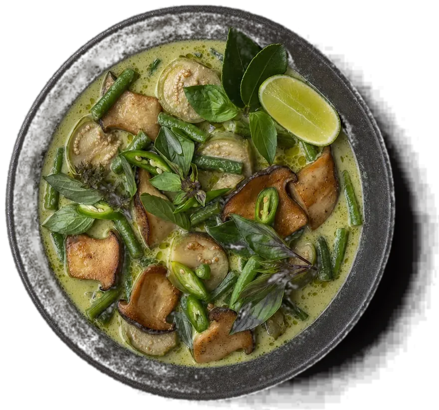 Close-up of green curry with mushrooms and red chilli